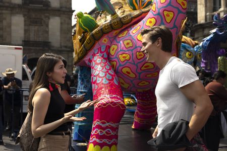 Fernanda explains the history and significance of the Alebrijes Parade to Antoni. (National Geographic/Alicia Vera)