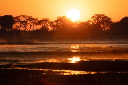 Sunrise over Zambia's Busanga Plains. (National Geographic/Clare Kingston)