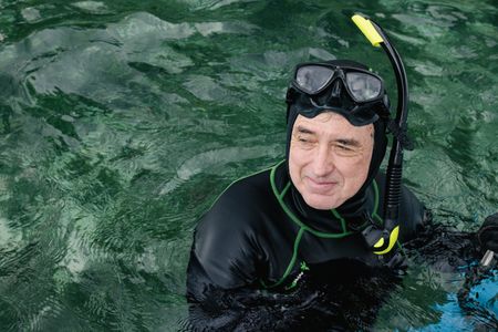 Cinematographer, Rory McGuinness, in snorkel gear to scout for Algae octopus (Abdopus aculeatus) in Bunaken Marine Park.   (photo credit: National Geographic/Harriet Spark)
