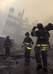 Firemen are deployed near the site of the World Trade Center in New York, in this Sept. 12, 2001, file photo. (AP Photo/Mark Lennihan/FILE)