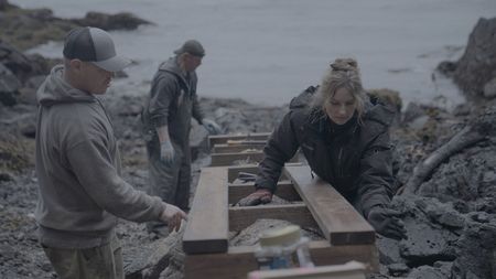 Troy Brockway, David Squibb, and Sarah McDonald construct a ramp from the beach up to Troy's property. (National Geographic/Gil Cano)