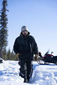 Tig Strassburg sets beaver traps in the winter season with his daughter. (National Geographic/Pat Henderson)