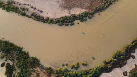 Crew traveling on a small boat in the Djoudj wetland of Senegal. (National Geographic)