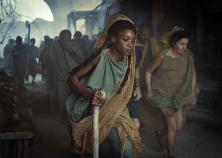 A woman runs out of the gates of Pompeii to escape the eruption of Mt. Vesuvius. (National Geographic/Darrin Zammit Lupi)