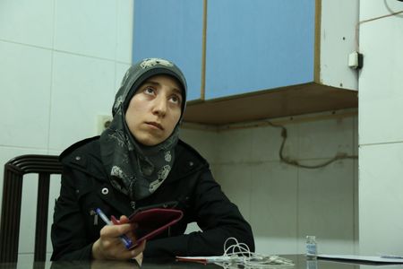Al Ghouta, Syria - Dr Amani in her office. (National Geographic)
