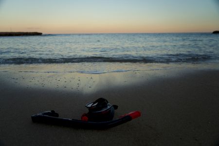 Snorkel and mask on the beach shoreline. (National Geographic/Mariana Kneppers)