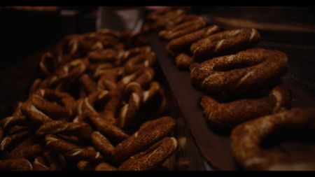 Sami Eryilmaz pulls Simit bread from the oven at his bakery in Istanbul. (National Geographic)