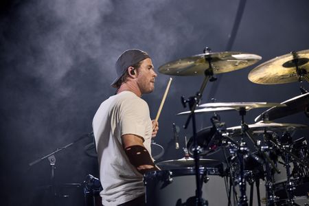 Chris Hemsworth drums during the Ed Sheeran concert in Bucharest. (credit: National Geographic/Evan Paterakis)