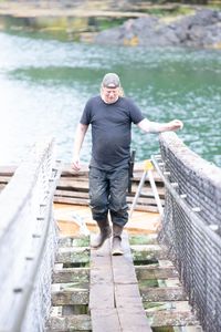 David Squibb helps repair a gangway. (National Geographic/Wes Waters)