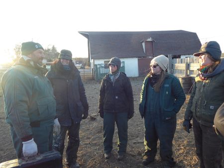 Drs. Ben and Erin Schroeder talk with clinic staff members Val Sovereign, Katelyn Fischer, and Laurel Driver after a successful day of cattle work. (National Geographic)