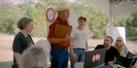 Having been told a potential candidate for the Doe, Detective David Turner (center) thanks the DNA Doe Project. (National Geographic)