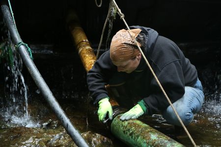 Veronica Arrants rebuilds a dam in her community. (National Geographic/Wayne Moss)