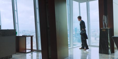 Antoni Porowski looks down at London from the Shangri La hotel suite. (National Geographic)