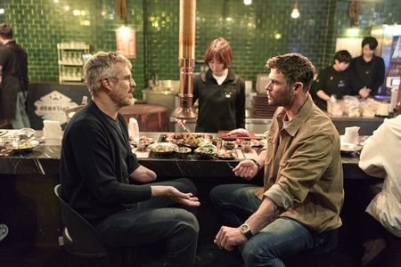 Chris Hemsworth sets out to confront his chronic pain in a bold, immersive journey through South Korea.  At a meal, Chris and Dr. B.J. Miller taste foods and discuss pain.  (credit: National Geographic/Evan Paterakis)