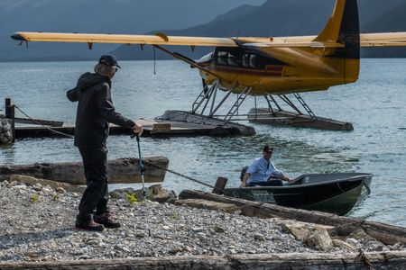 Sir Ranulph Fiennes talks with Joseph Fiennes who is getting ready for a boat ride in the beautiful aqua-green waters of Muncho Lake surrounded by an impressive backdrop of the foothills of the Rockies. Amidst mountains and whale watching, Sir Ranulph Fiennes and his cousin Joseph Fiennes reflect on Ran’s epic life and his new challenge of life with Parkinson’s. (National Geographic)