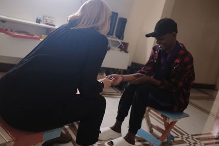 Mariana van Zeller interviews Apple in a safe house in Uganda. (National Geographic)