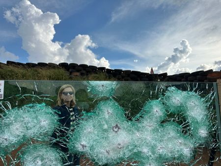 Mariana van Zeller looks through bullet-proof glass. (National Geographic)