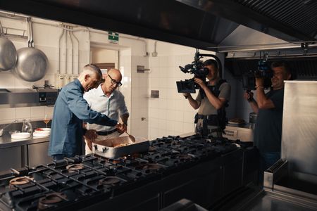 TUCCI IN ITALY - “Sardinia” - Stanley Tucci in the kitchen of Da Tonino with Giuseppe Bertoleoni, the heir to the throne of Tavolara. He also runs the kitchen. (National Geographic/Matt Holyoak)GIUSEPPE BERTOLEONI, STANLEY TUCCI