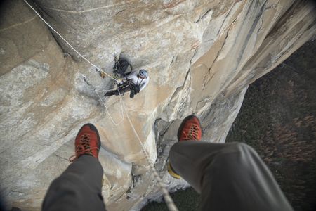Jimmy Chin dangles on a rope above  Cheyne Lempe as they wait for Alex Honnold to reach them. They're positioned on Freerider on El Capitan in Yosemite National Park. (National Geographic/Jimmy Chin)