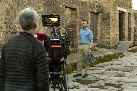 Host and Executive Producer Tom Hiddleston walks the streets of Pompeii, behind-the-scenes of Pompeii: Out of Time with Tom Hiddleston. (National Geographic/Paolo Verzone)