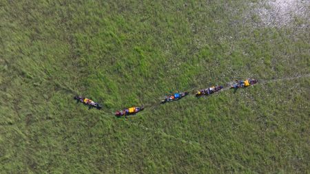 An team paddles down the Kagera River, collecting data on the health of the river. (The Wilderness Project Foundation)