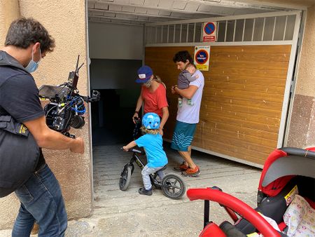 Gerd Serrasolses, Ali Casas, and their children get kayaks out from the garage on their way to the river in Sort, Spain.  (National Geographic/Gene Gallerano)