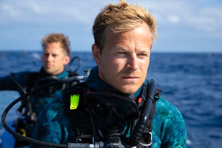 Underwater cameraman, Jeff Hester and host, Bertie Gregory looking out for the next dive site.  (credit: National Geographic/Adam Boyle)