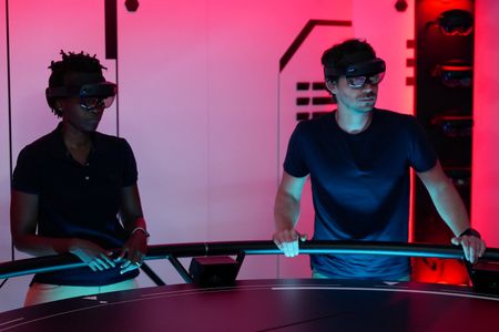 Zoleka Filander and Eric Stackpole in the Hololab on the OceanXplorer. (National Geographic/Mario Tadinac)