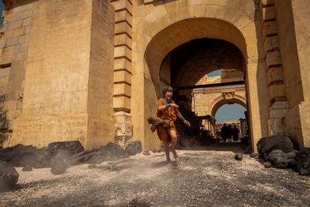 Avianius, played by Frankie Treadaway, flees Pompeii, sprinting through the city gates to escape the pyroclastic flow. (National Geographic/Darrin Zammit Lupi)