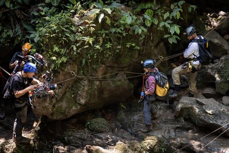 Carla Perez leads Will Smith as he prepares to descend 206 feet into La Cueva de los Tayos as they go to search for new life. (credit: National Geographic/Kyle Christy)