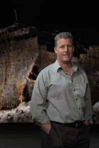 Chris Hearn stands in front of the Titanic digital twin in the virtual studio. (National Geographic/Gary Moyes)