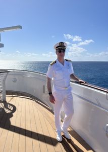 Captain Marco stands on the bow of the Disney Treasure, as he prepares to be the first captain of Disney's newest cruise ship.   (credit: National Geographic/Jenn Brehm)