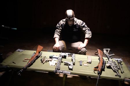 Black Cat Rifle Group co-founder El Gato showcases weaponry. (National Geographic)