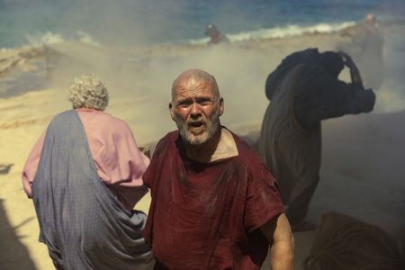 Standing on the beach of Herculaneum, the Praetorian, played by Barry Aird, looks up to see the ash column of Vesuvius rising into the sky. (National Geographic/Darrin Zammit Lupi)