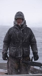 Daniel , Nalu and Ala Apassingok search for seals in the ice covered sea. (National Geographic/Zach Clanton)