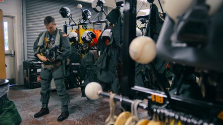 Student LTJG Andrew Seepe in the paraloft. (Credit: National Geographic)