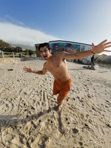 Caleb Swanepoel on Camps Bay Beach, Cape Town. (National Geographic/Robert Cowling)