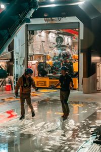 Eric Stackpole and Jorge Fontes on deck in front of the submarine with Crew Nickolay Todorov, Buck Taylor, and Jamie Holland inside. (National Geographic/Patrick Hopkins)