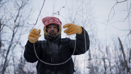 Tig Strassburg sets wolf traps along his trail. (National Geographic)