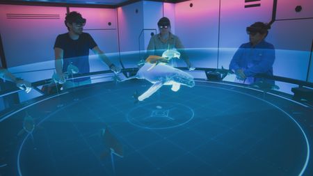Eric Stackpole, Kerri Seger and Mithriel Mackay are in the Hololab analyzing the orca tag footage from the predation event in an effort to understand their hunting strategy. (National Geographic)