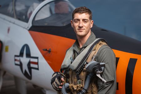 Student 1st LT Austin Claggett poses next to a T-45. (Credit: National Geographic/Freddie Claire)