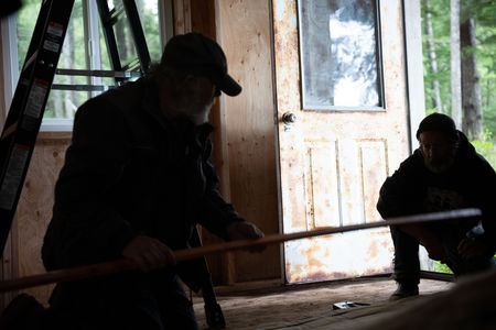 Terry Simpson is grateful for Dave Palmer's help in building him a new cabin. (National Geographic/Robert Jolley)