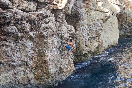 Chris recruits the help of Steph Davis, one of the best free solo climbers in the world, to train for a ëDeep Water Soloingì ñ no ropes, no safety equipment, just Chris climbing the rock face from the sea to the top of the cliff. This training will help prepare him for his final 600-foot climb on a wintery Swiss Alps Dam. (credit: National Geographic/Evan Paterakis)