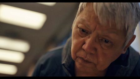 Investigator and residential school survivor Charlene Belleau searches through newly released records to identify deaths and abuses of children at St. Joseph's Mission. (Credit: Emily Kassie/Sugarcane Film LLC)