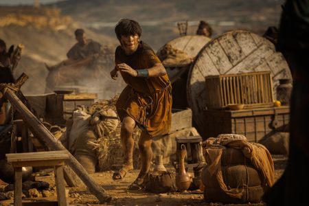 Avianius, played by Frankie Treadaway, sprints through the Pompeii displacement camp, running desperately towards Marcus Masurius to reunite.   (National Geographic/Darrin Zammit Lupi)