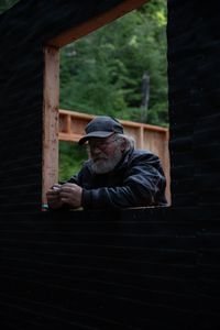Terry Simpson is grateful for his neighbors' help in building him a new cabin. (National Geographic/Robert Jolley)