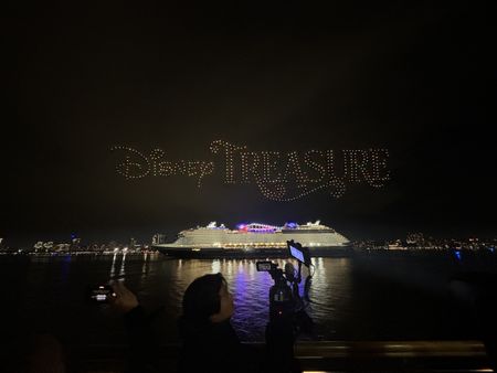 A drone show lights up the night sky to celebrate the Disney Treasure's christening in New York City. (credit: National Geographic/Troy Schreiber)