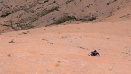 Alex Honnold scouts Les Rivieres Pourpres in preparation for his free solo of the route.  (photo credit: National Geographic)