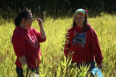 Breanna Miethe and Veronica Arrants pick berries. (National Geographic/Wayne Moss)