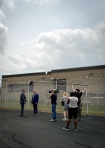 Crew films Inspector Bill Jones and Sergeant Bryan Johnson outside the jail at Stark County Sheriff's Office. (National Geographic/Venita Kidza)